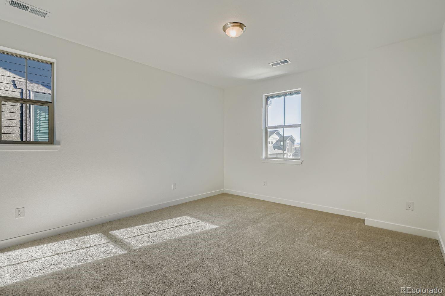 15433 West Dequesne Avenue Morrison, CO 80465 - Photo 11 of 16 an empty room with windows