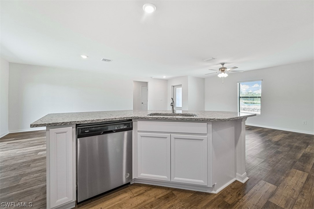 877 General Chesty Puller Court LaBelle, FL 33935 - Photo 11 of 22 a kitchen with granite countertop a sink cabinets and stainless steel appliances