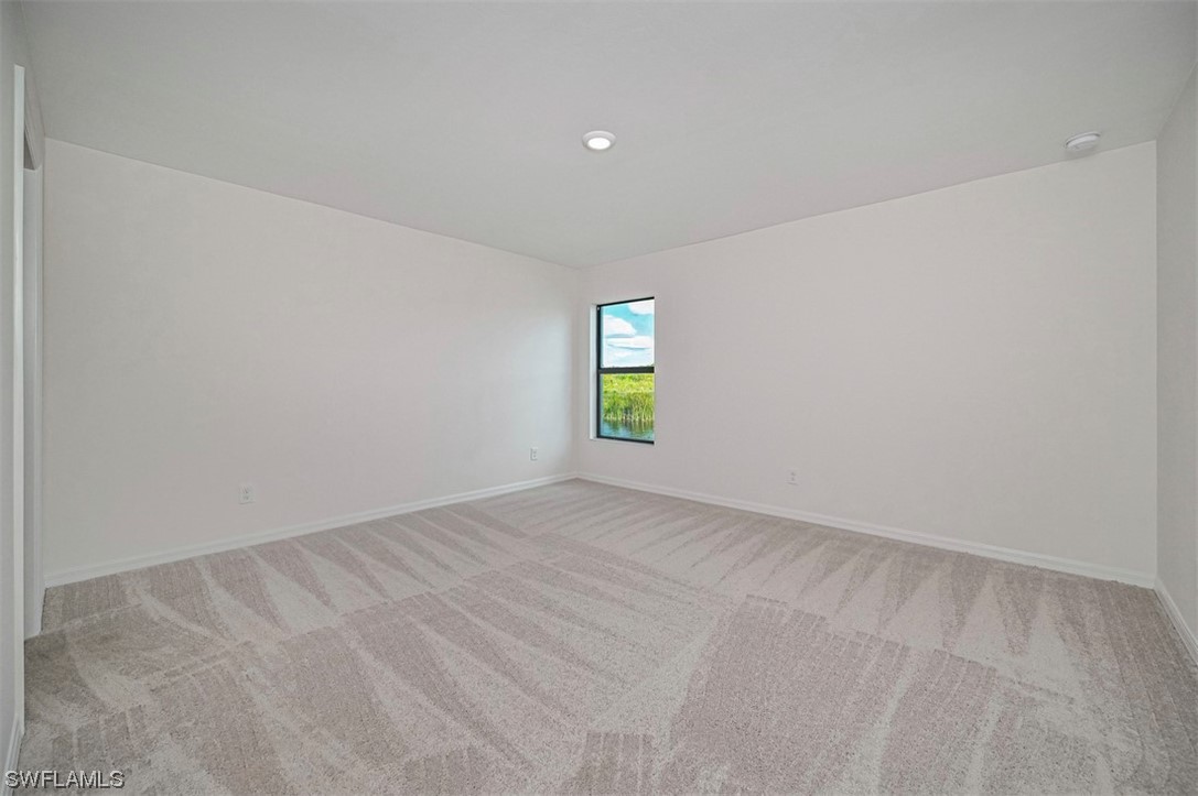 877 General Chesty Puller Court LaBelle, FL 33935 - Photo 13 of 22 a view of an empty room with window