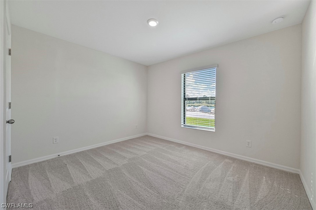 877 General Chesty Puller Court LaBelle, FL 33935 - Photo 18 of 22 an empty room with windows