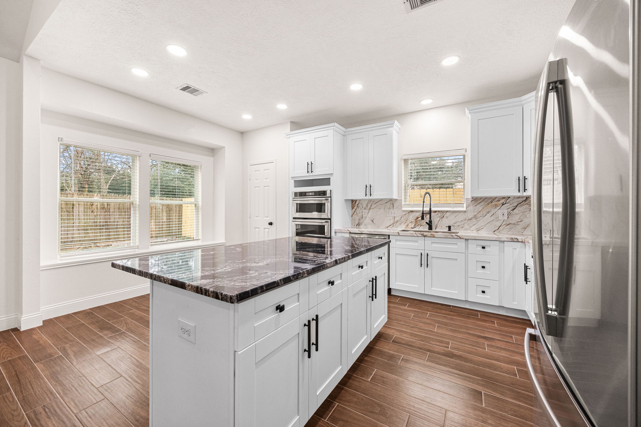 17907 Pelican Way Road Houston, TX 77084 - Photo 12 of 39 a kitchen with stainless steel appliances granite countertop a sink stove and refrigerator