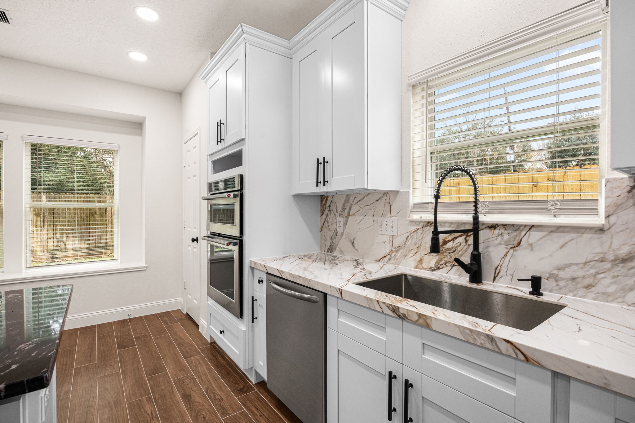 17907 Pelican Way Road Houston, TX 77084 - Photo 18 of 39 a kitchen with stainless steel appliances a sink a stove and a window