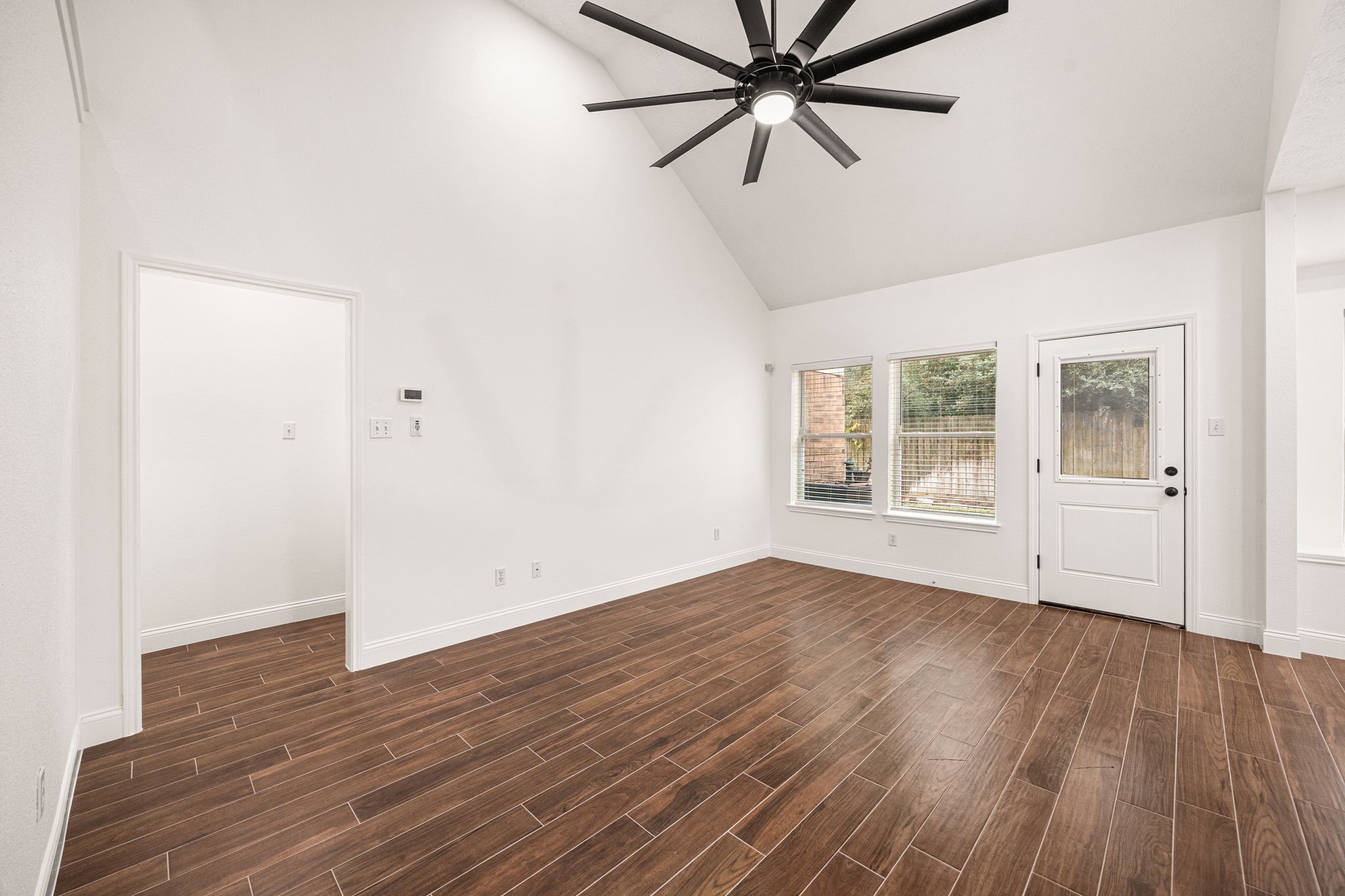 17907 Pelican Way Road Houston, TX 77084 - Photo 20 of 39 wooden floor in an empty room with a window