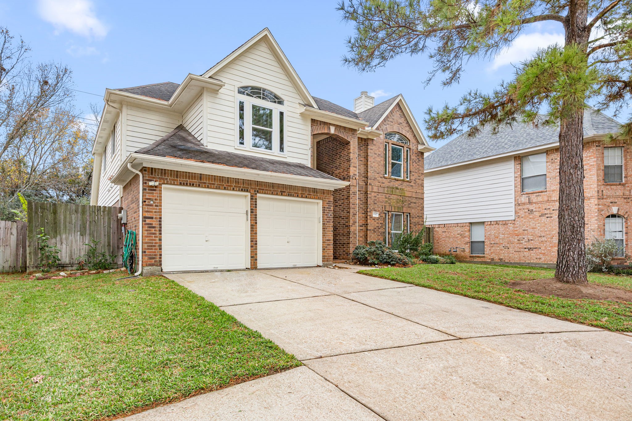 17907 Pelican Way Road Houston, TX 77084 - Photo 2 of 39 a front view of a house with a yard and garage