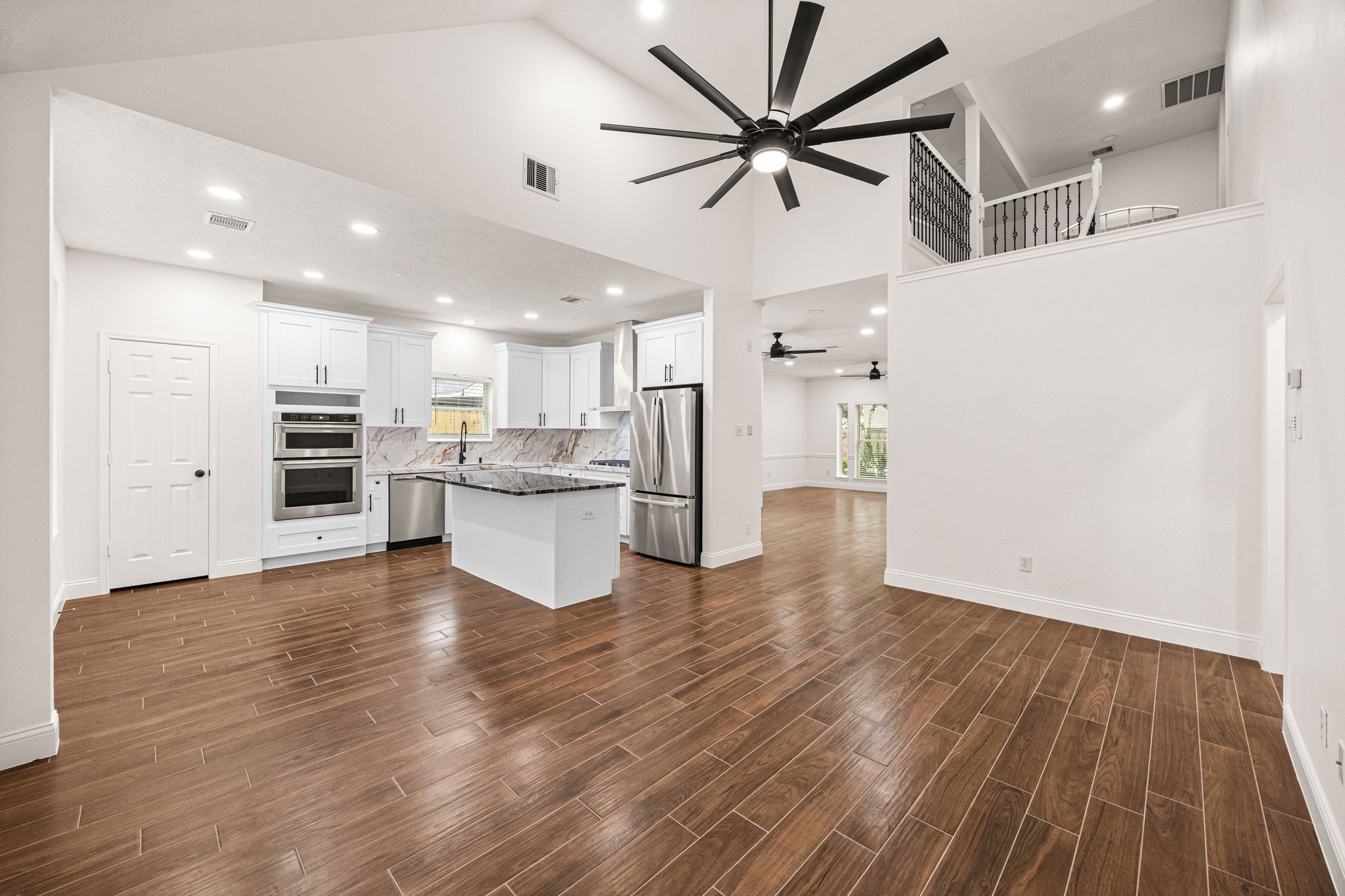 17907 Pelican Way Road Houston, TX 77084 - Photo 22 of 39 a view of kitchen with refrigerator microwave and stove