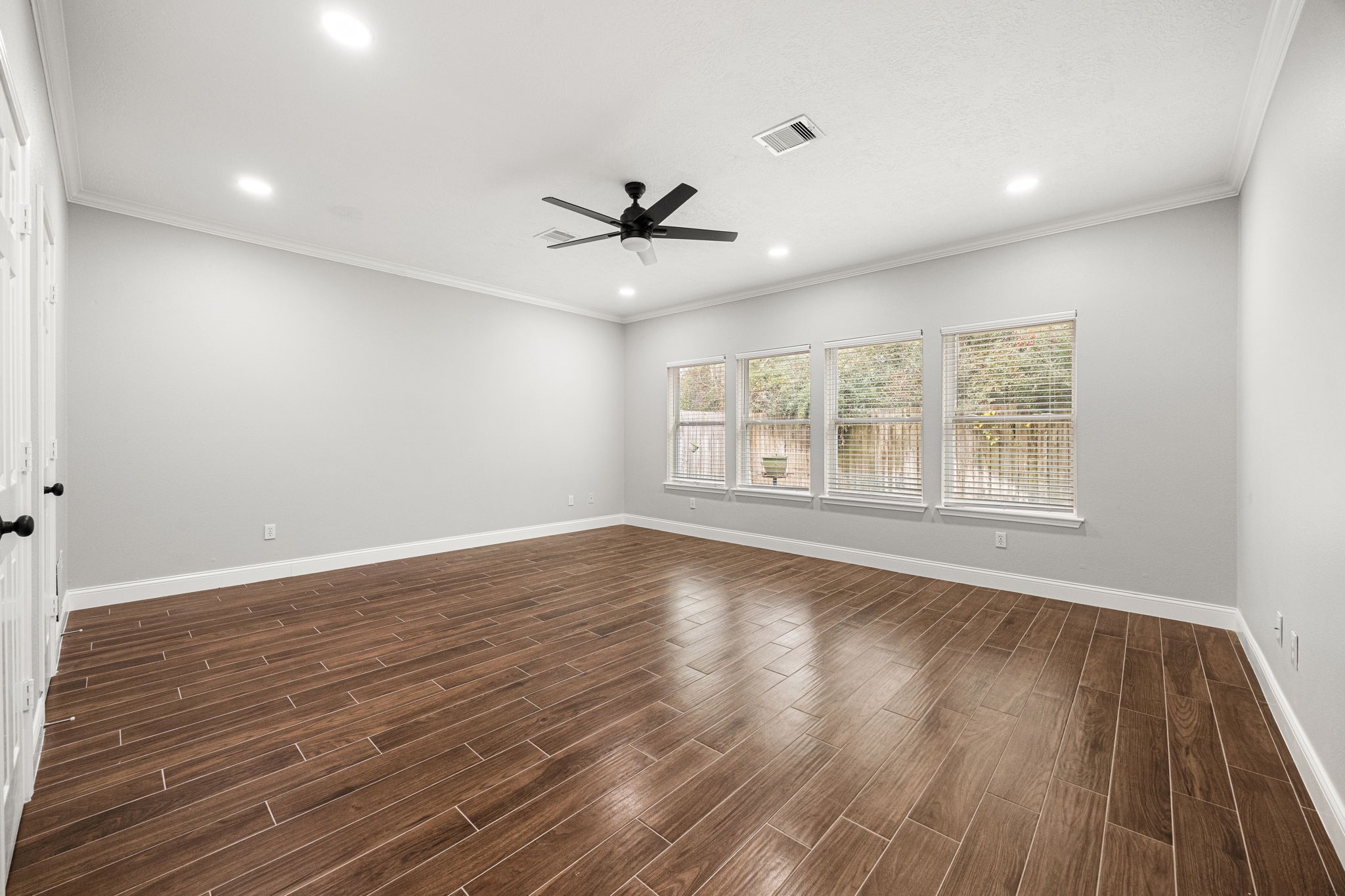 17907 Pelican Way Road Houston, TX 77084 - Photo 24 of 39 a view of an empty room with wooden floor and a window