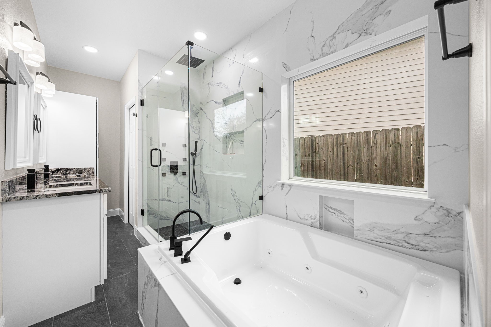 17907 Pelican Way Road Houston, TX 77084 - Photo 26 of 39 a bathroom with a granite countertop sink mirror and window