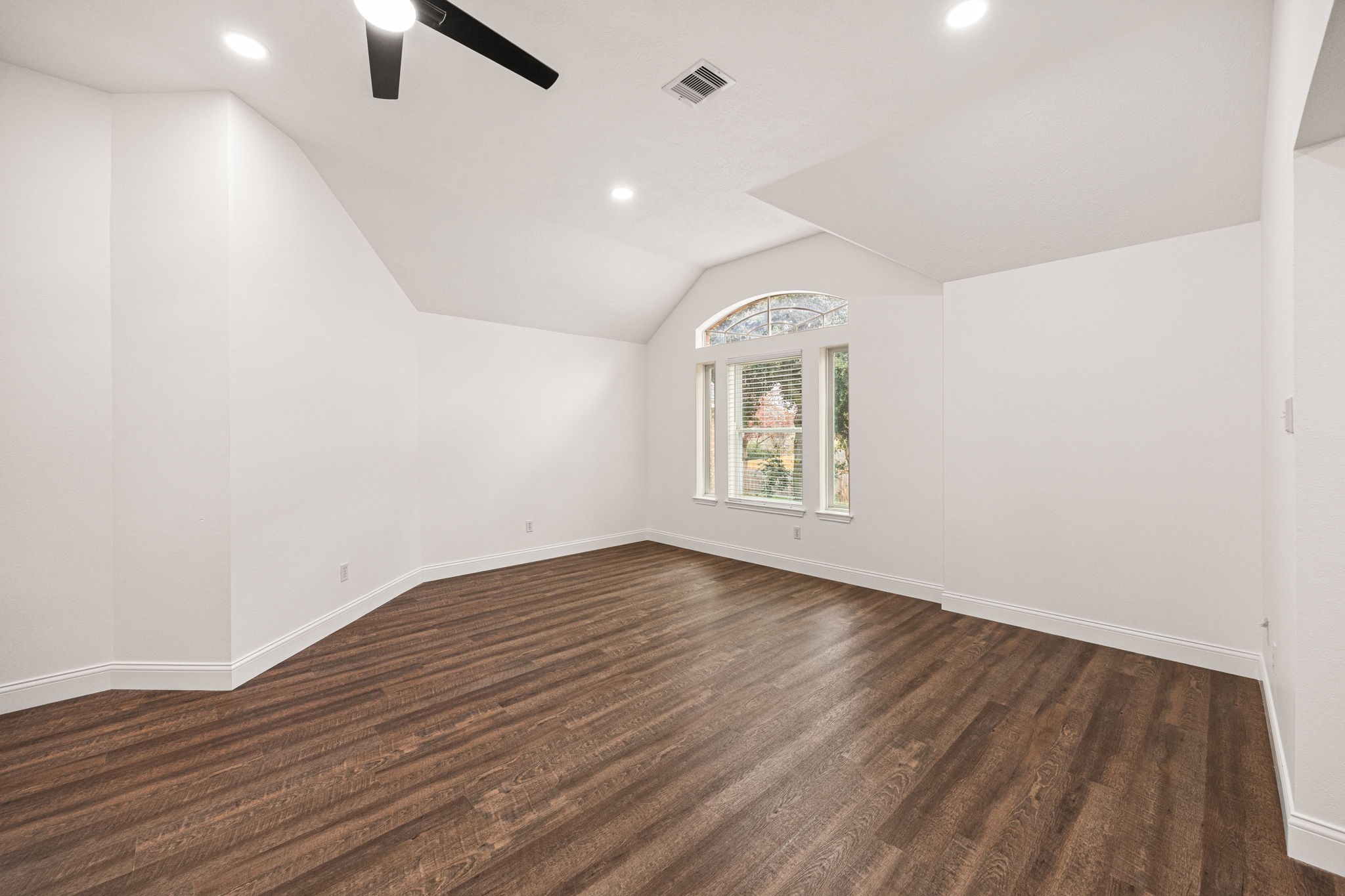 17907 Pelican Way Road Houston, TX 77084 - Photo 28 of 39 an empty room with wooden floor and windows
