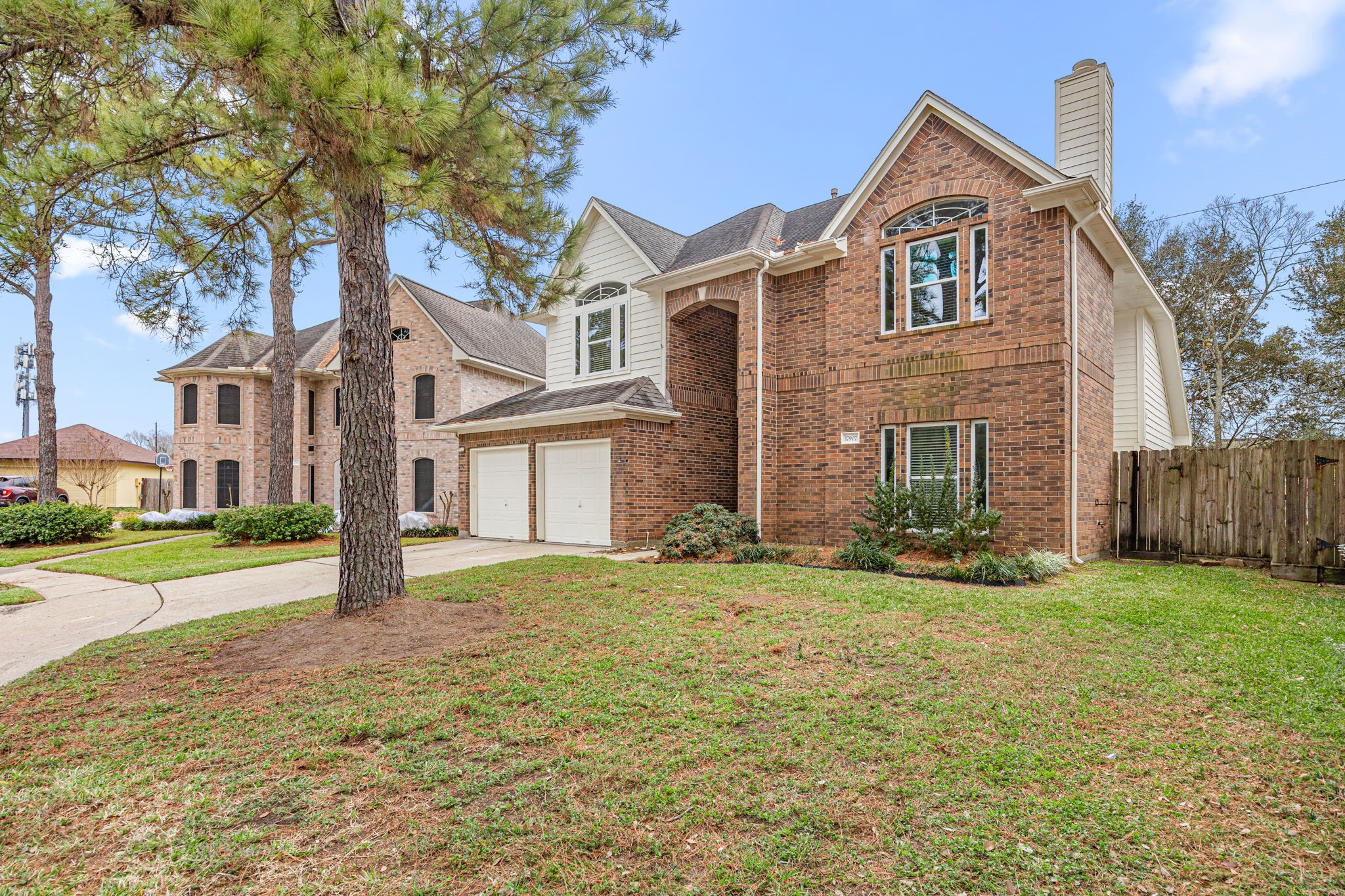 17907 Pelican Way Road Houston, TX 77084 - Photo 3 of 39 a front view of a house with a yard and garage