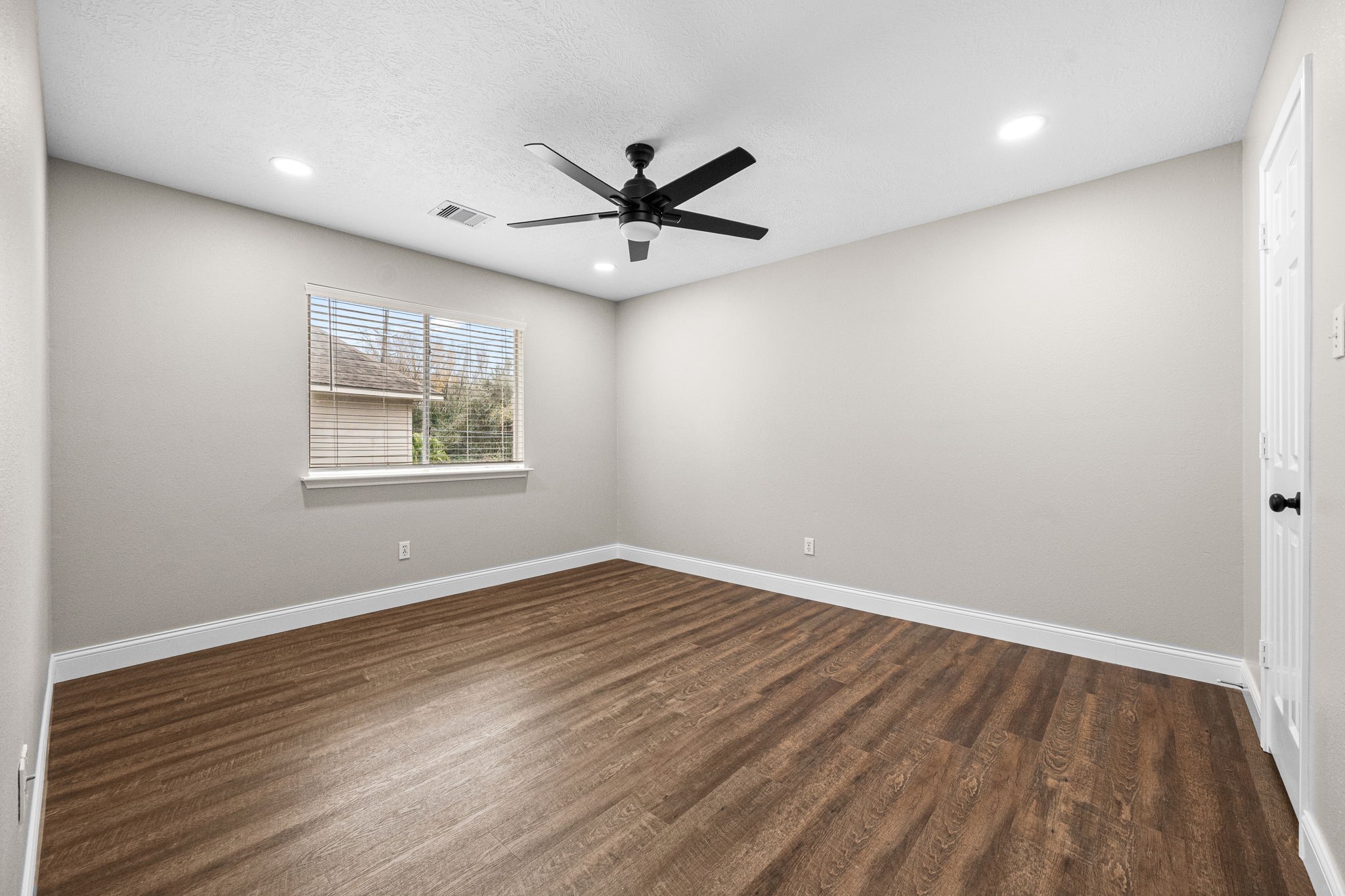 17907 Pelican Way Road Houston, TX 77084 - Photo 33 of 39 wooden floor in an empty room with a window
