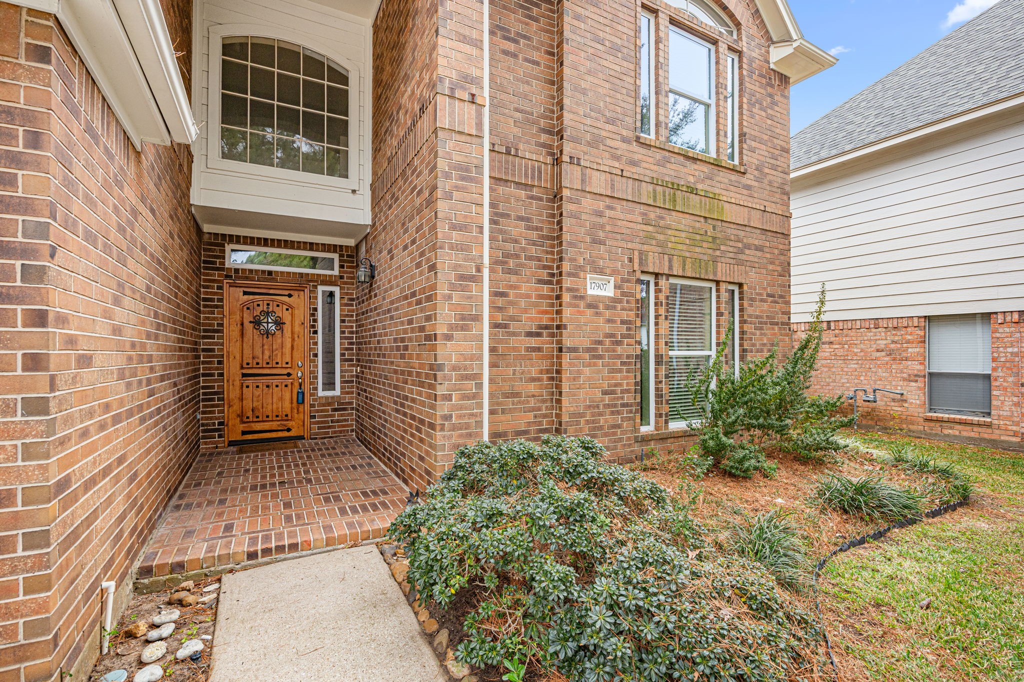 17907 Pelican Way Road Houston, TX 77084 - Photo 4 of 39 a view of a brick house with potted plants