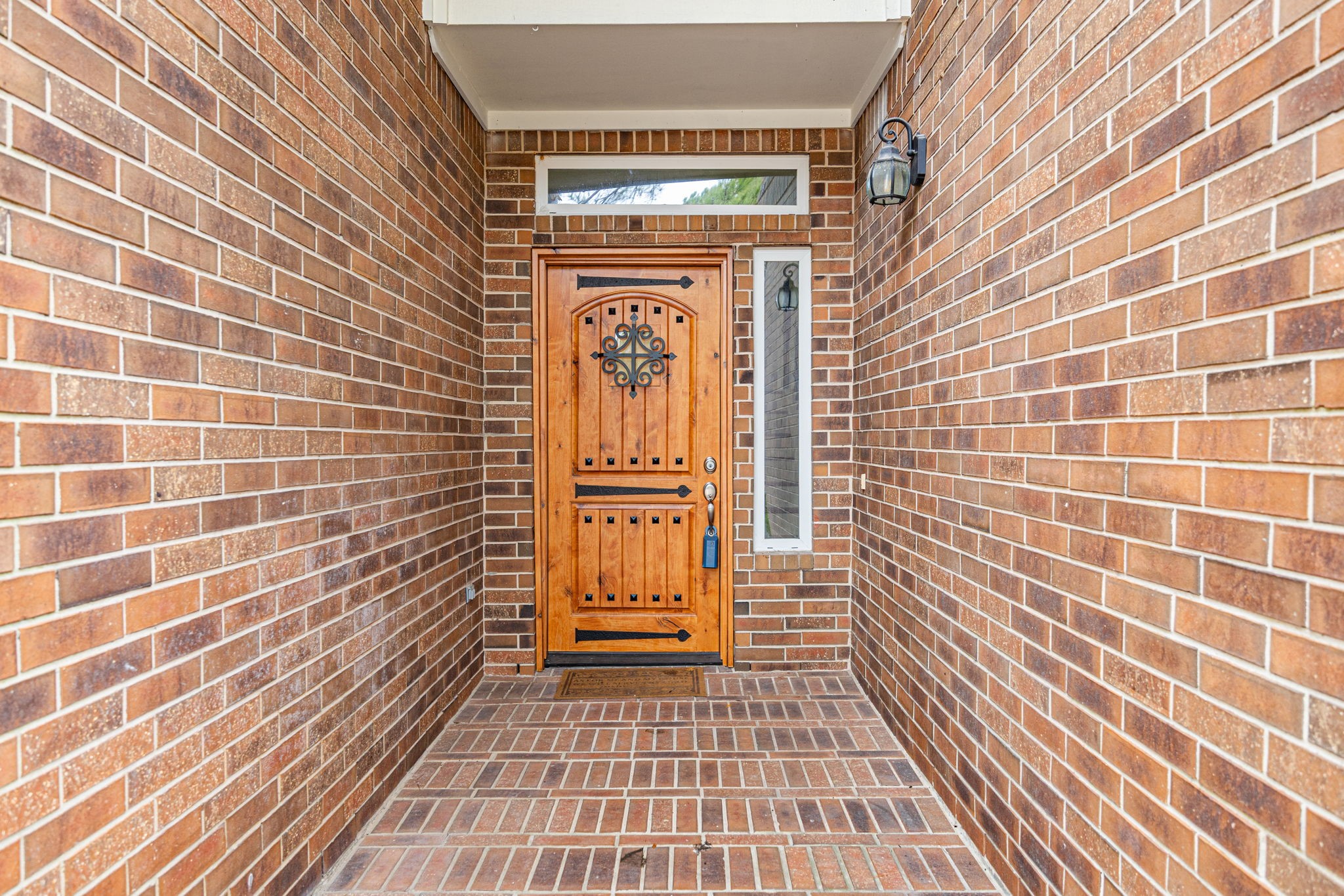 17907 Pelican Way Road Houston, TX 77084 - Photo 5 of 39 a view of a brick house with wooden door