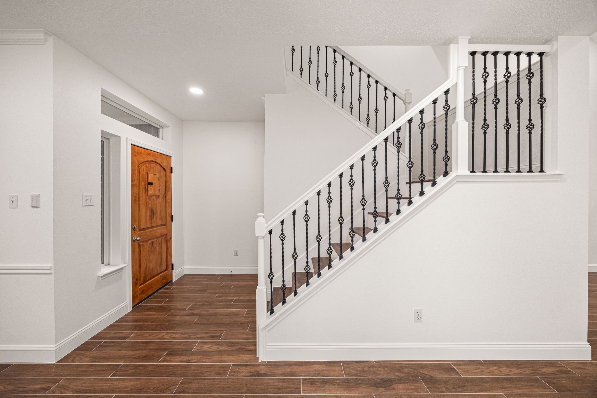 17907 Pelican Way Road Houston, TX 77084 - Photo 6 of 39 a view of staircase with railing and white walls