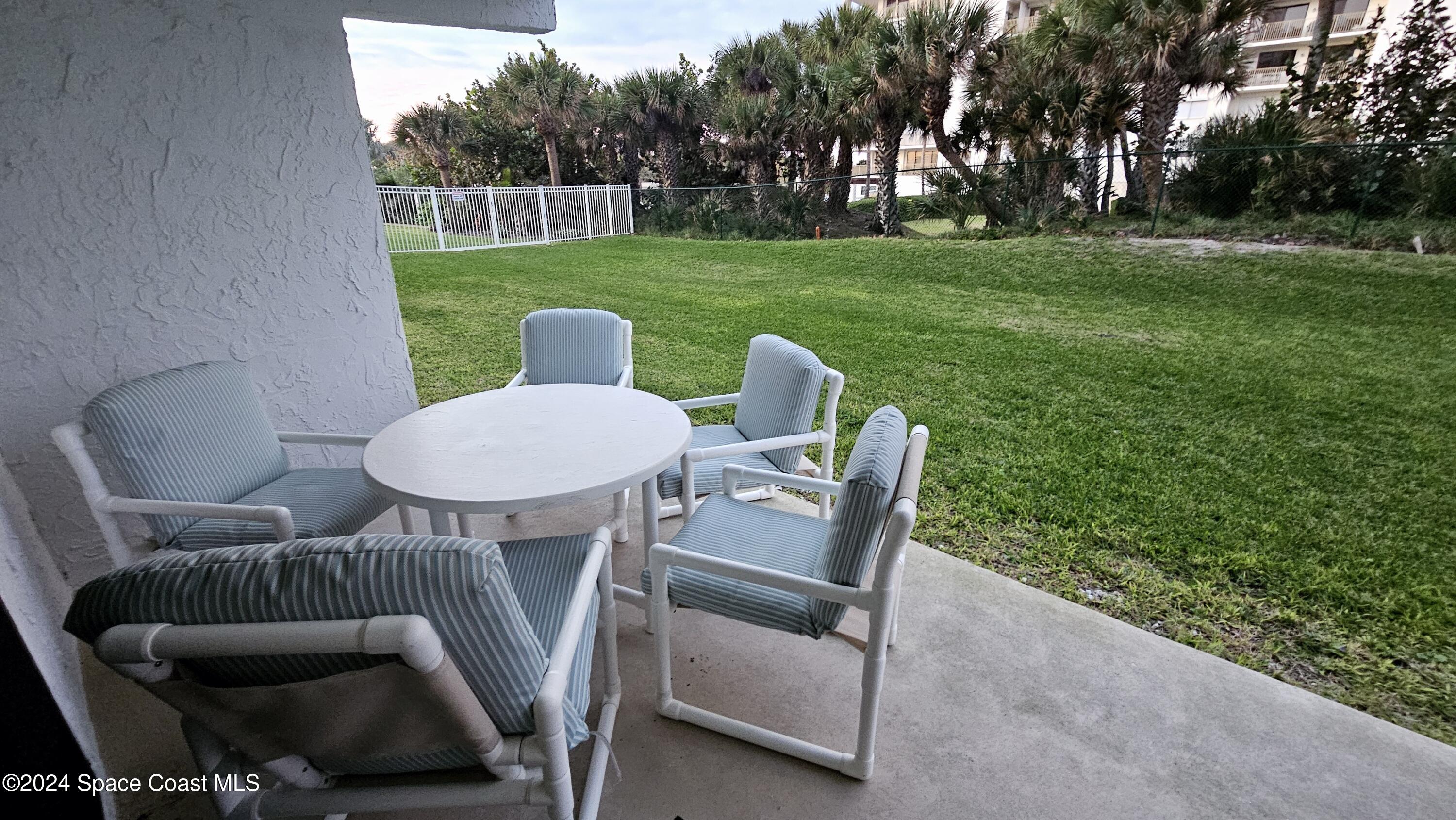 650 North Atlantic Avenue, Unit 109 Cocoa Beach, FL 32931 - Photo 24 of 36 a view of a patio with garden