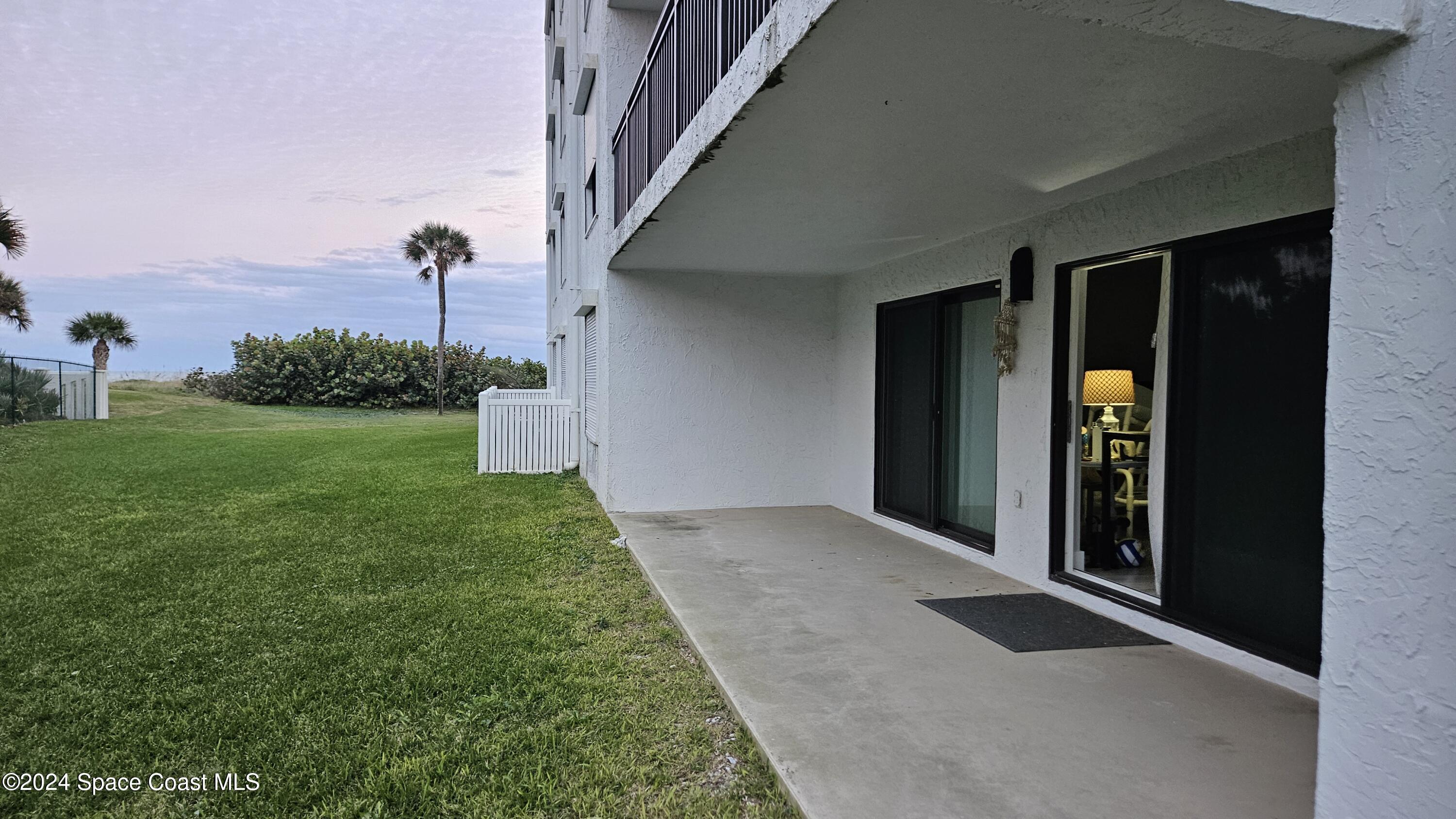 650 North Atlantic Avenue, Unit 109 Cocoa Beach, FL 32931 - Photo 25 of 36 a view of outdoor space and yard