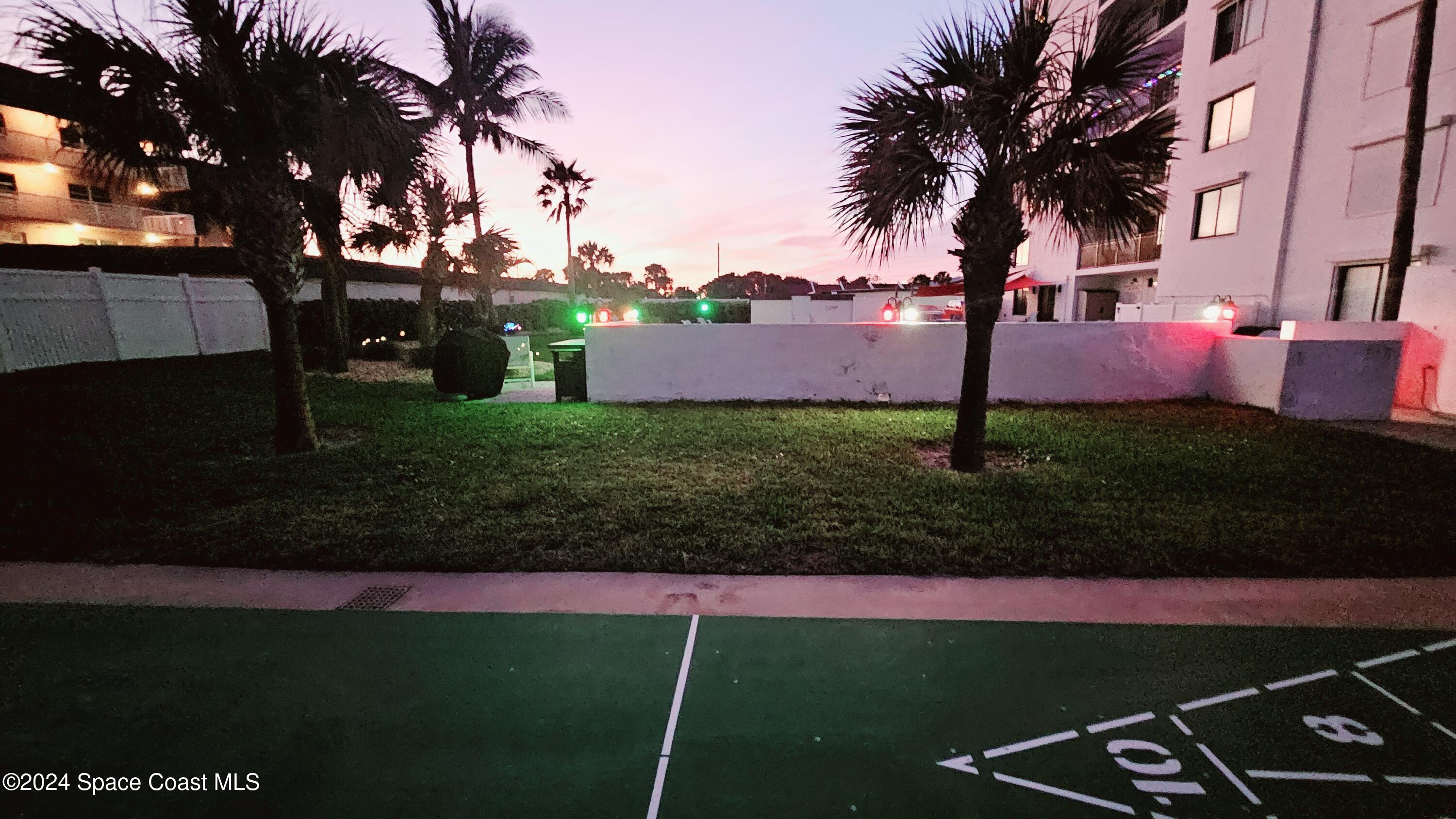 650 North Atlantic Avenue, Unit 109 Cocoa Beach, FL 32931 - Photo 28 of 36 a view of a park with a tree