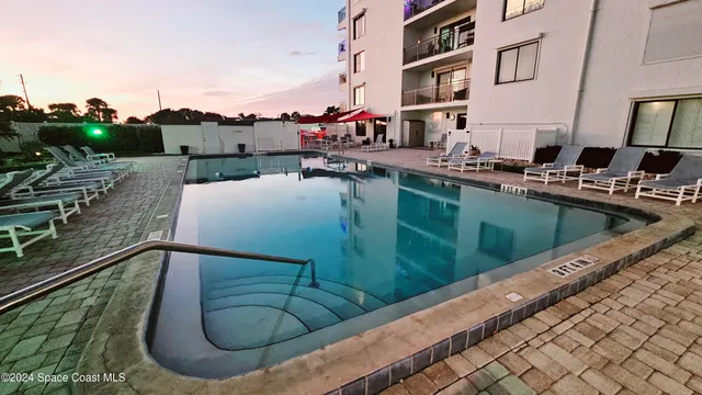 a view of swimming pool from a balcony