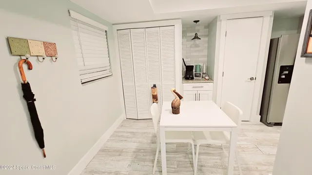 a white bath tub sitting next to a bathroom sink