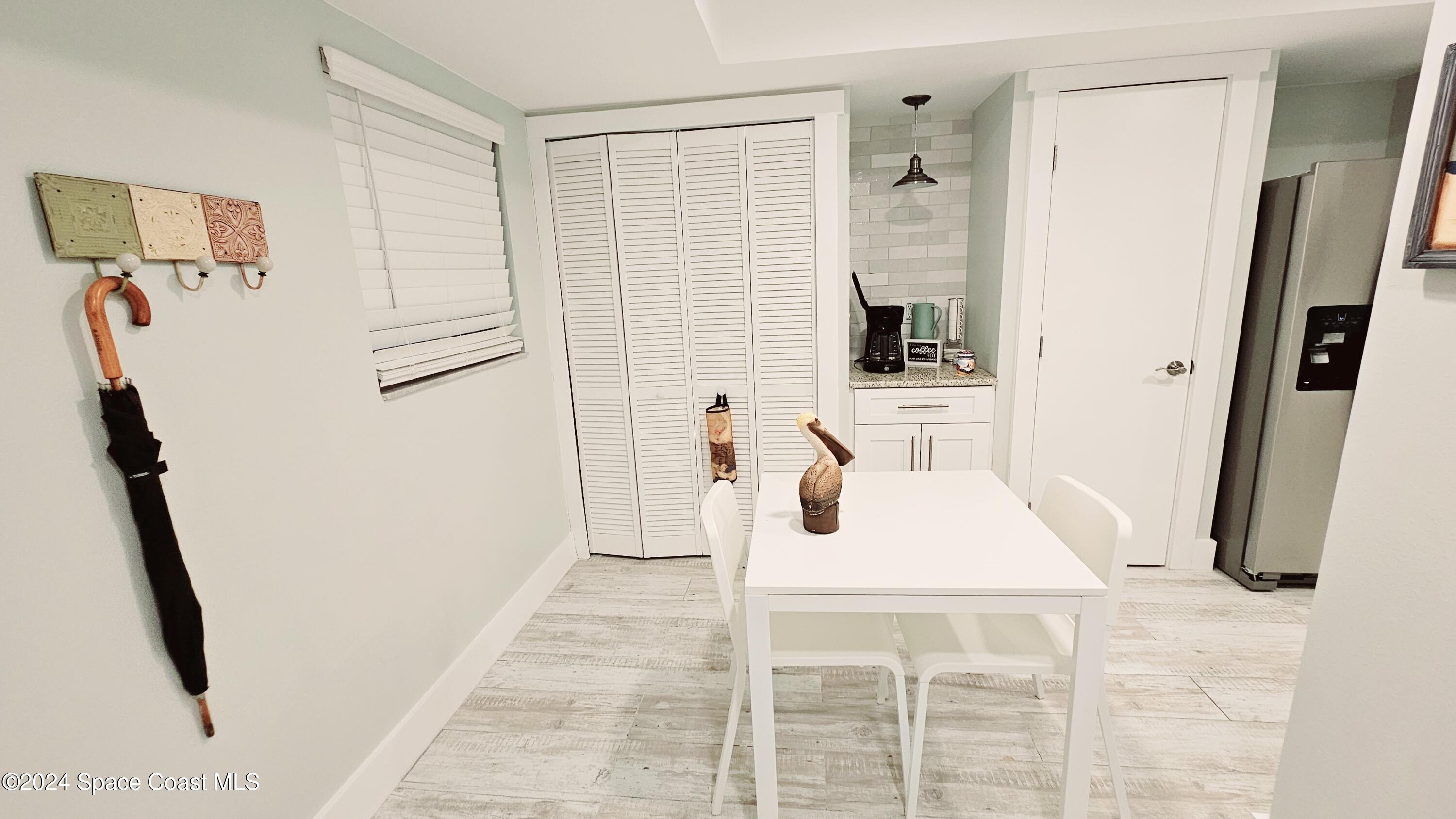 650 North Atlantic Avenue, Unit 109 Cocoa Beach, FL 32931 - Photo 7 of 36 a white bath tub sitting next to a bathroom sink