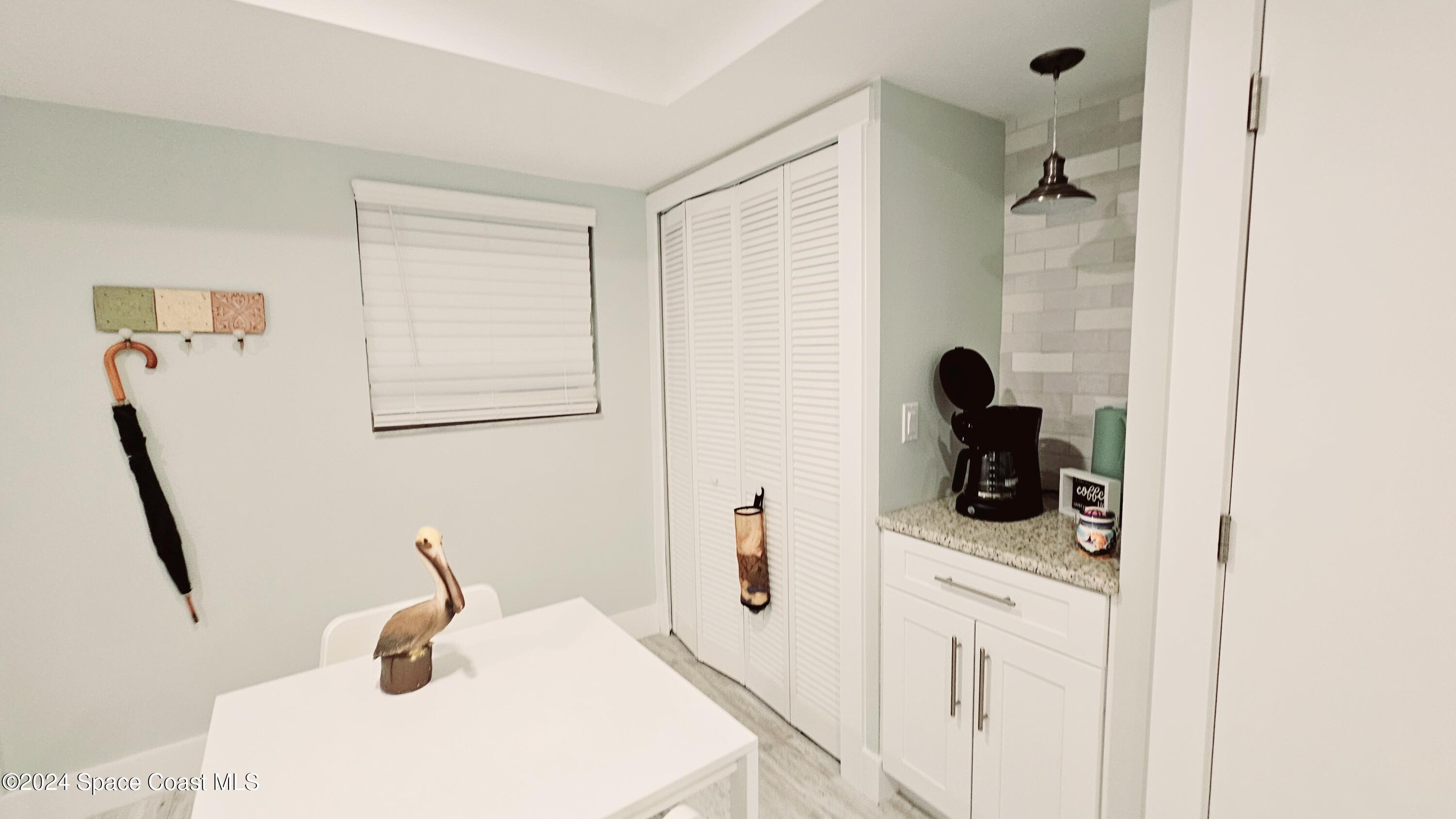 650 North Atlantic Avenue, Unit 109 Cocoa Beach, FL 32931 - Photo 8 of 36 a bathroom with a sink and a mirror