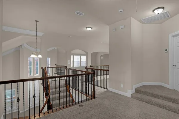 a view of a hallway with windows