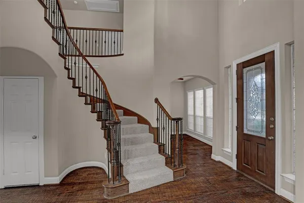 a view of entryway with wooden floor