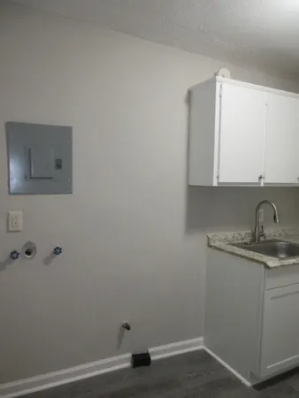 a kitchen with a sink and cabinets