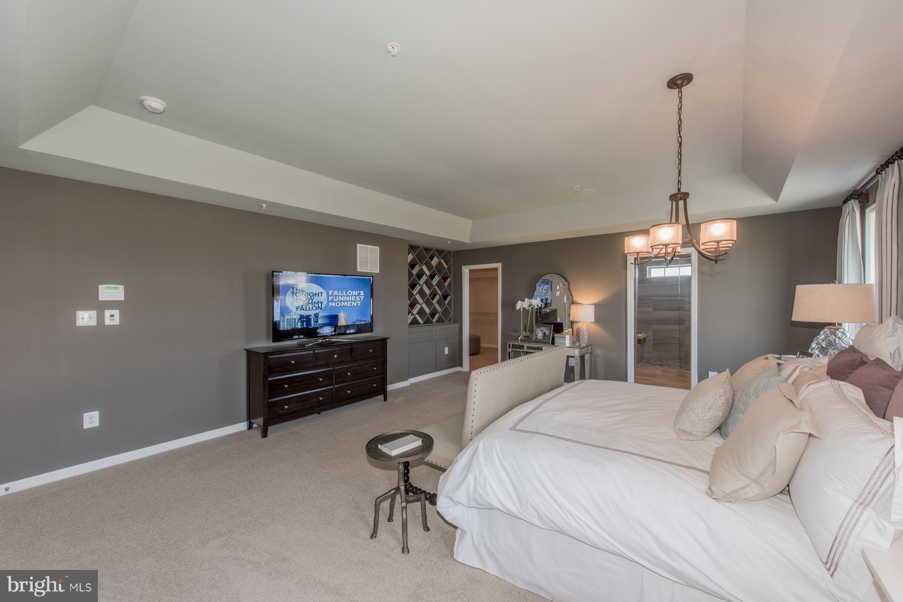 9772 Powder Hall Road Perry Hall, MD 21128 - Photo 23 of 28 a bedroom with a bed and a flat screen tv