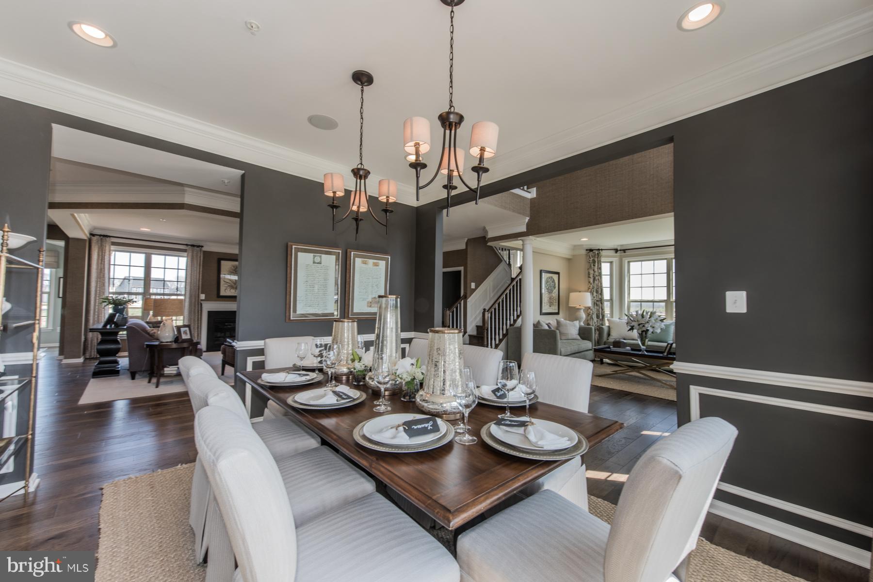 9772 Powder Hall Road Perry Hall, MD 21128 - Photo 6 of 28 a view of a dining room with furniture wooden floor and chandelier