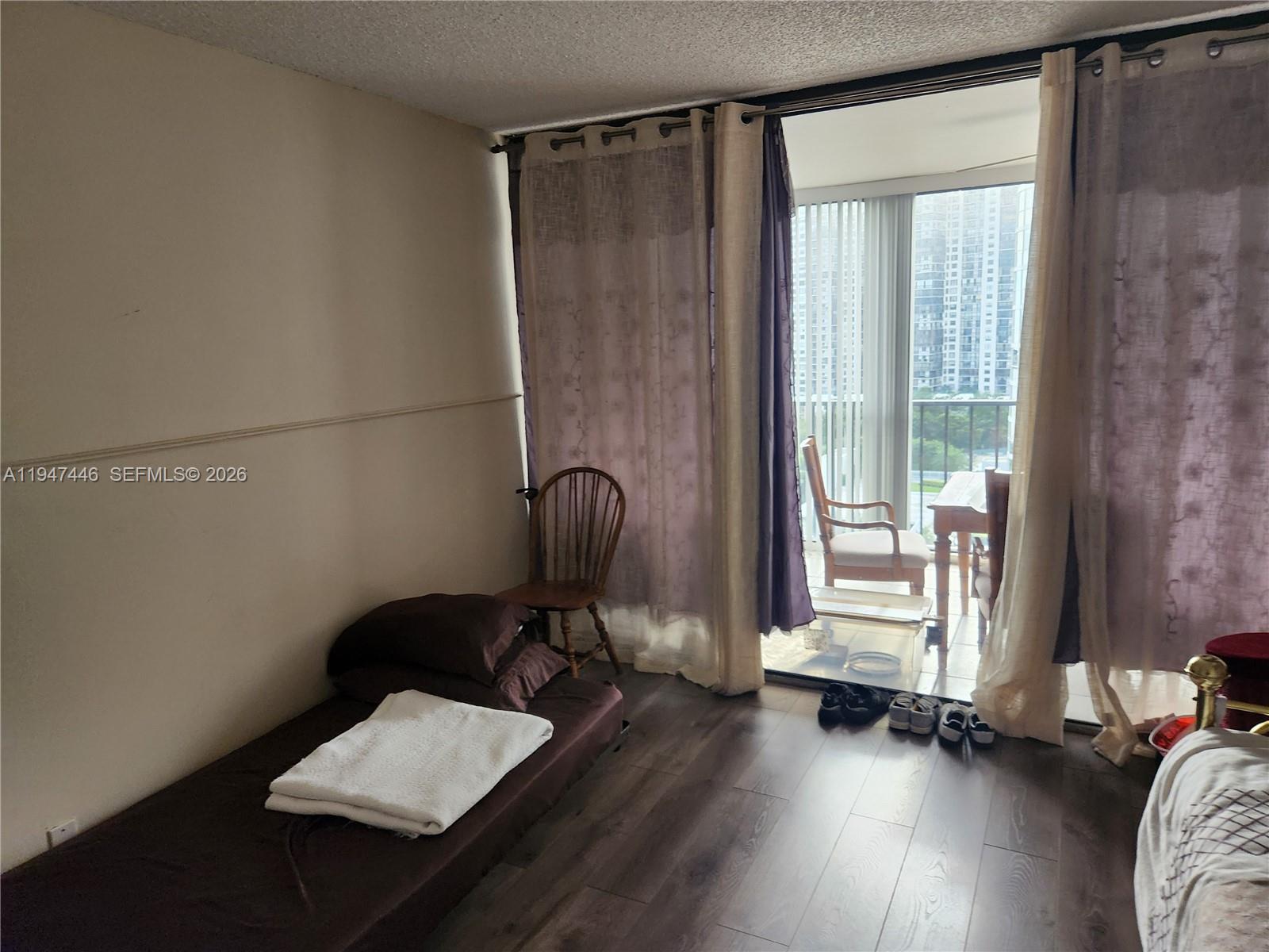 1925 Brickell Avenue, Unit 1411 Miami, FL 33129 - Photo 21 of 52 a view of a hardwood floor and in a bedroom