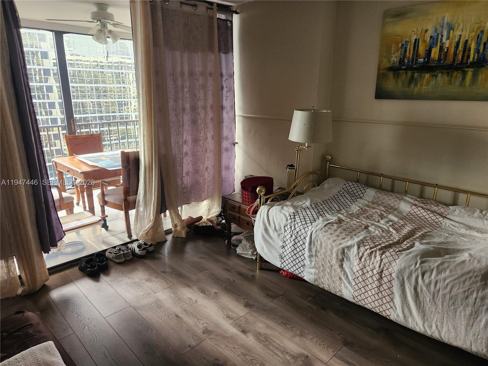 1925 Brickell Avenue, Unit 1411 Miami, FL 33129 - Photo 22 of 52 a bedroom with a bed and window