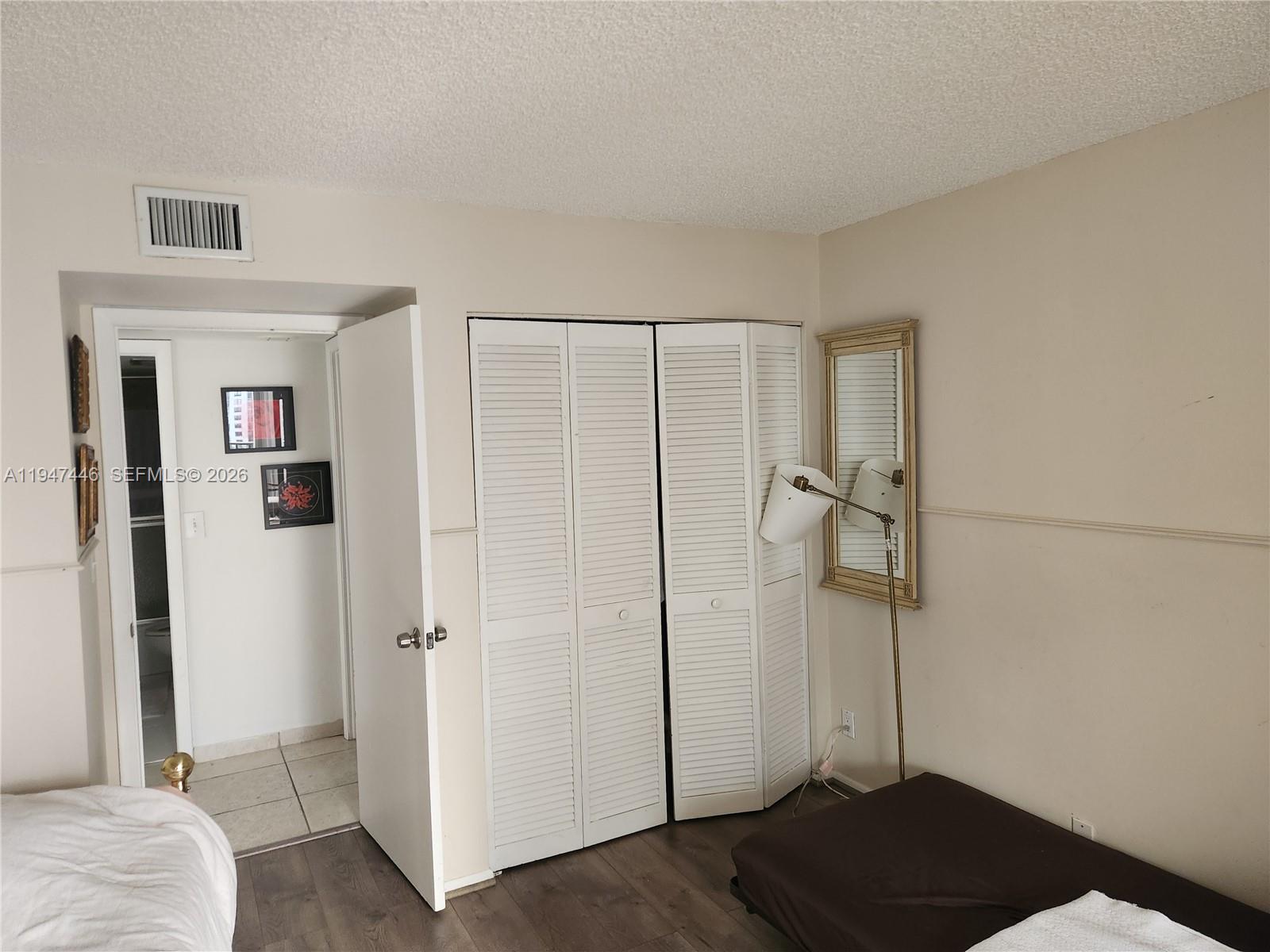 1925 Brickell Avenue, Unit 1411 Miami, FL 33129 - Photo 23 of 52 a view of bedroom with furniture and wooden floor