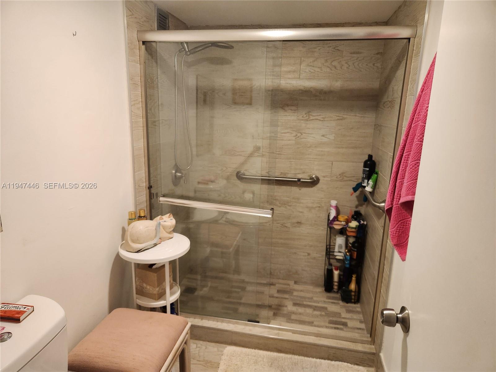1925 Brickell Avenue, Unit 1411 Miami, FL 33129 - Photo 25 of 52 a bathroom with a sink and a mirror