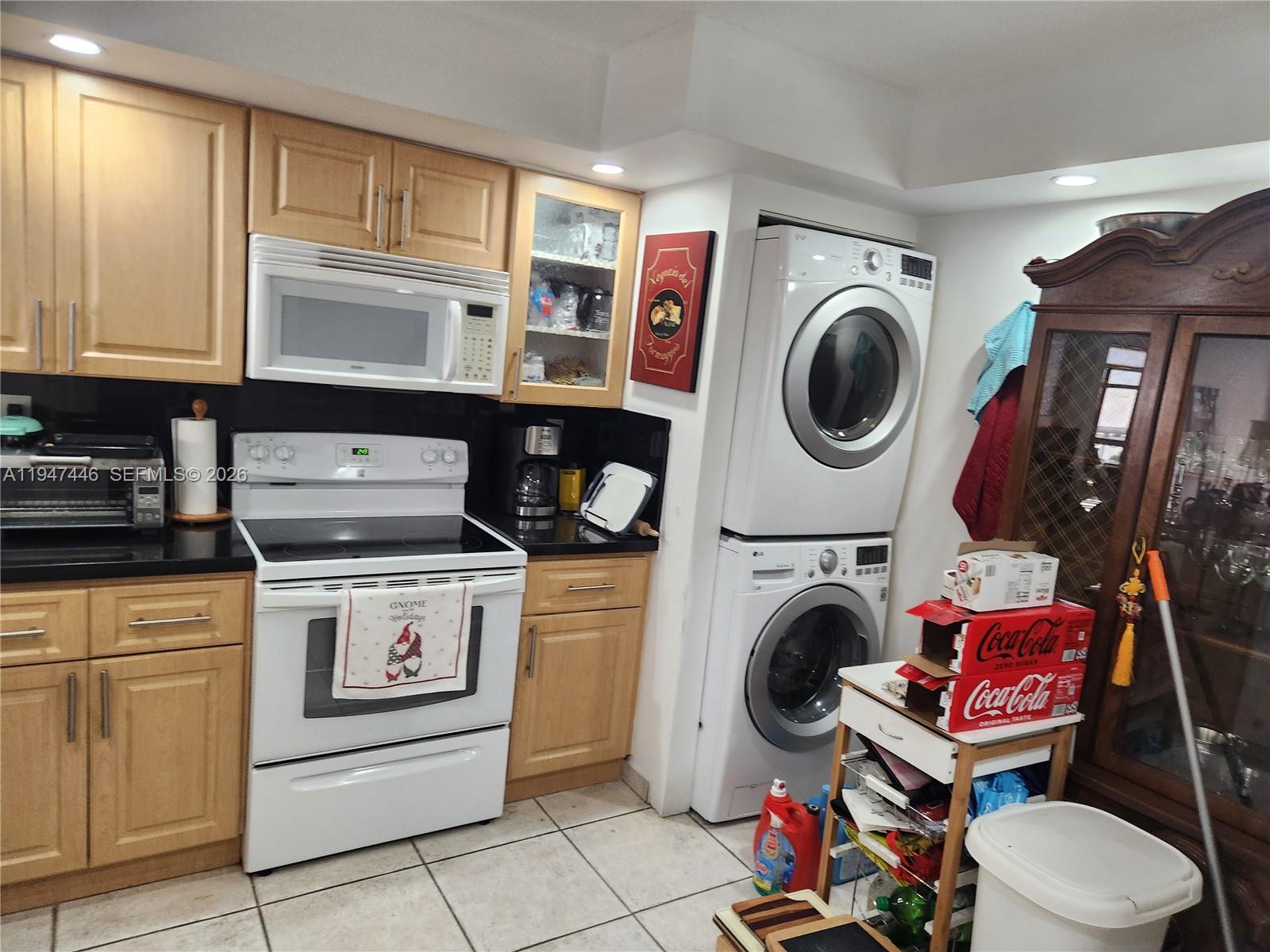 1925 Brickell Avenue, Unit 1411 Miami, FL 33129 - Photo 3 of 52 a utility room with dryer washer and closet