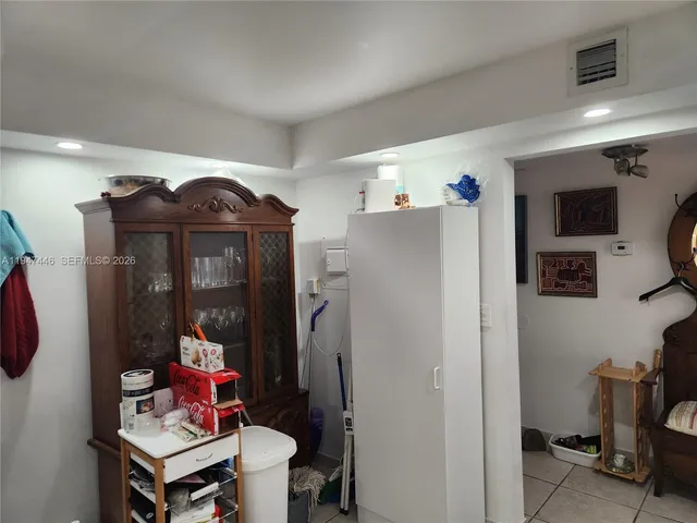 a kitchen with stainless steel appliances granite countertop a refrigerator sink and cabinets