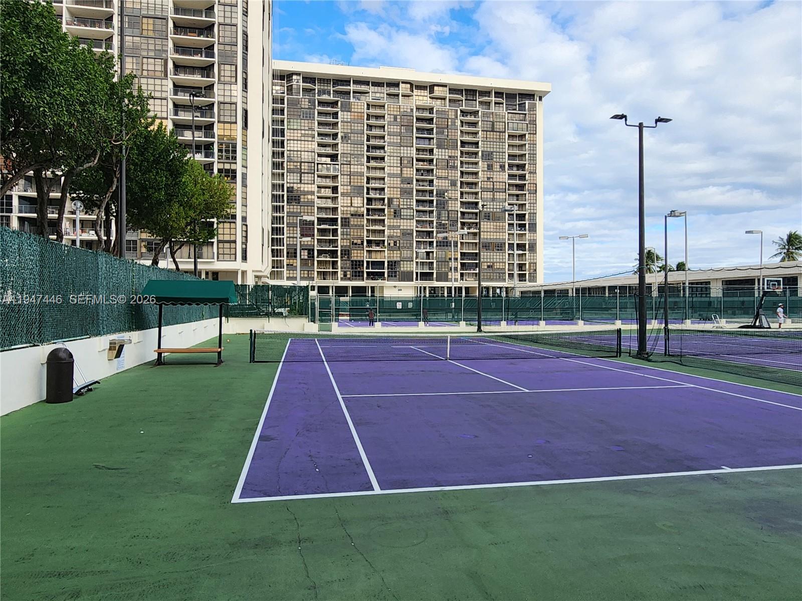1925 Brickell Avenue, Unit 1411 Miami, FL 33129 - Photo 44 of 52 a tennis court with view of tall buildings