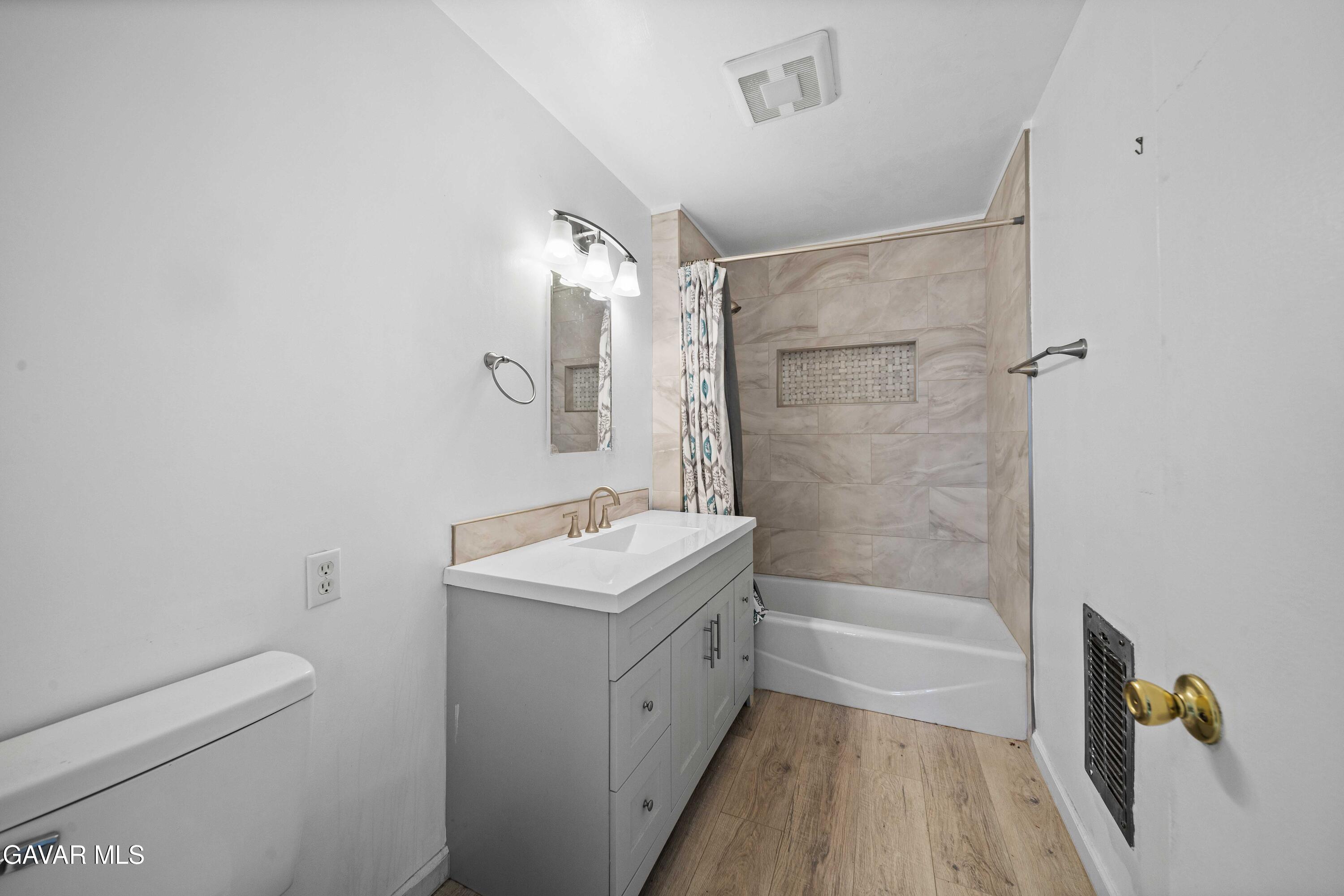 2000 Shasta Street Mojave, CA 93501 - Photo 21 of 21 a bathroom with a tub a sink and a shower