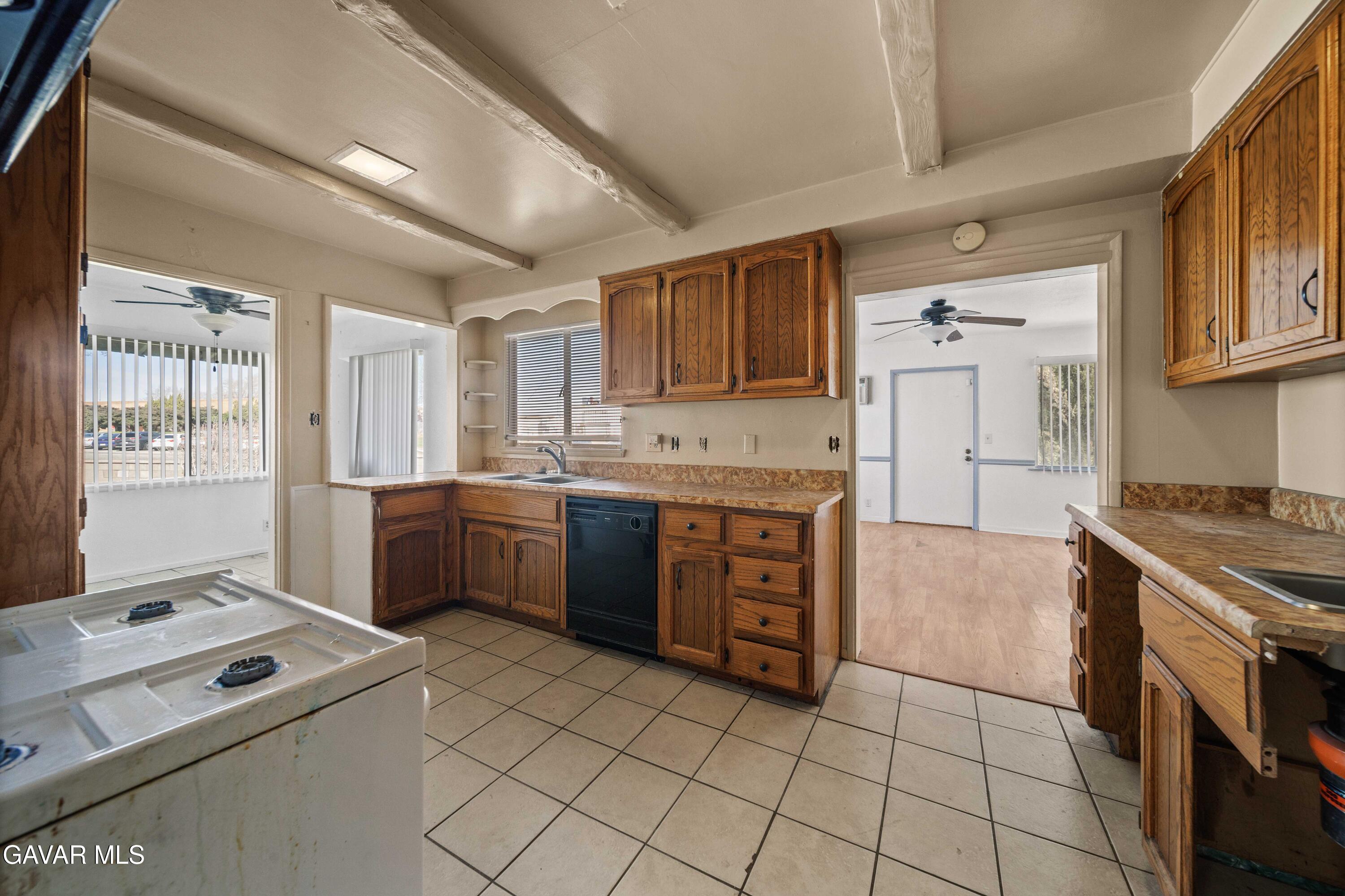2000 Shasta Street Mojave, CA 93501 - Photo 3 of 21 a kitchen with a stove top oven sink and cabinets