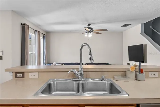 a kitchen with a sink and a window