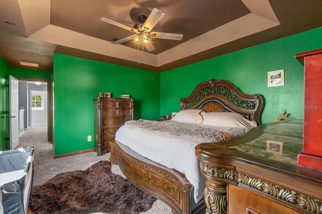 a bedroom with a bed and a television