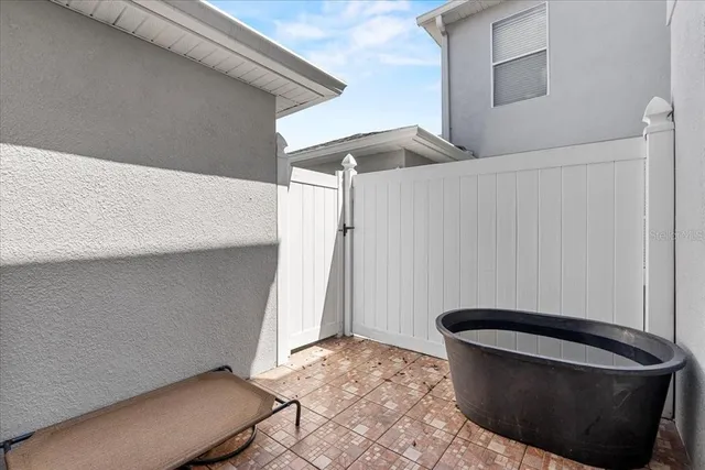 a view of hallway with livingroom and furniture