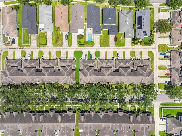 an aerial view of residential building with outdoor space