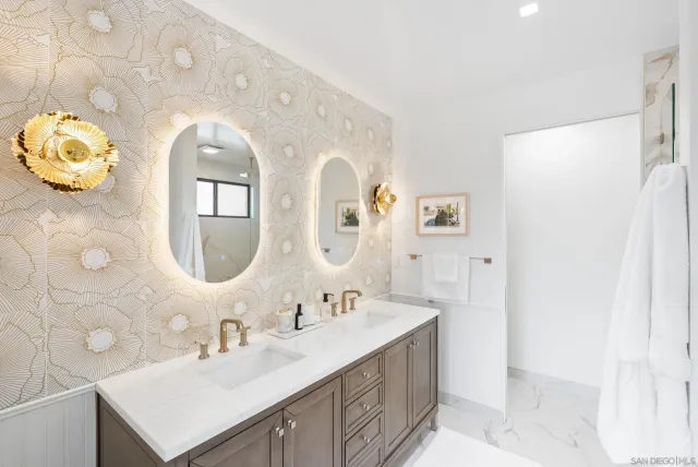 a bathroom with a sink double vanity and a mirror