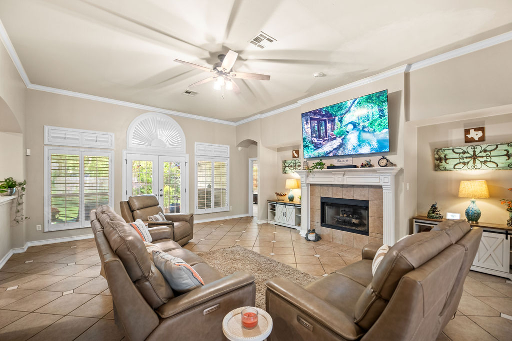 4600 Slickrock Cove Austin, TX 78747 - Photo 13 of 40 a living room with furniture fireplace and a flat screen tv