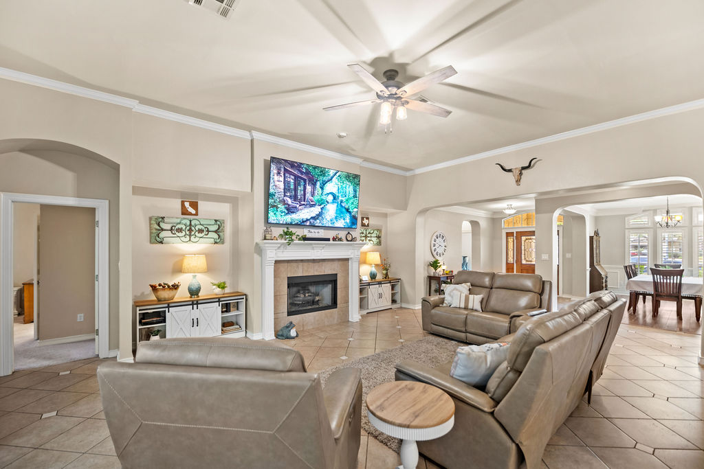 4600 Slickrock Cove Austin, TX 78747 - Photo 15 of 40 a living room with furniture and a fireplace