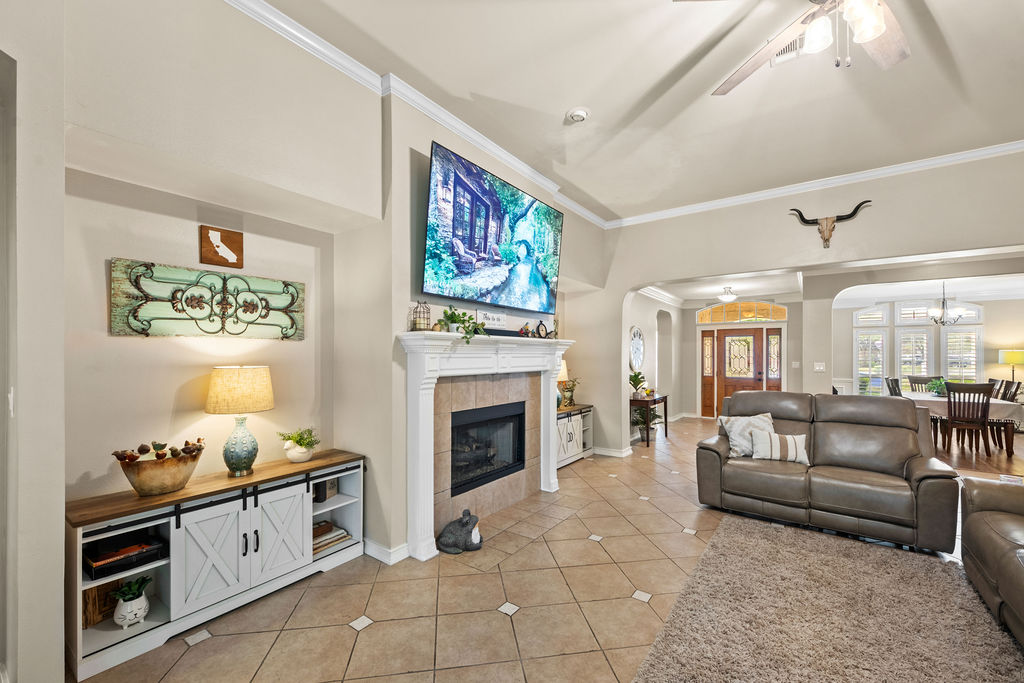 4600 Slickrock Cove Austin, TX 78747 - Photo 18 of 40 a living room with furniture and a fireplace