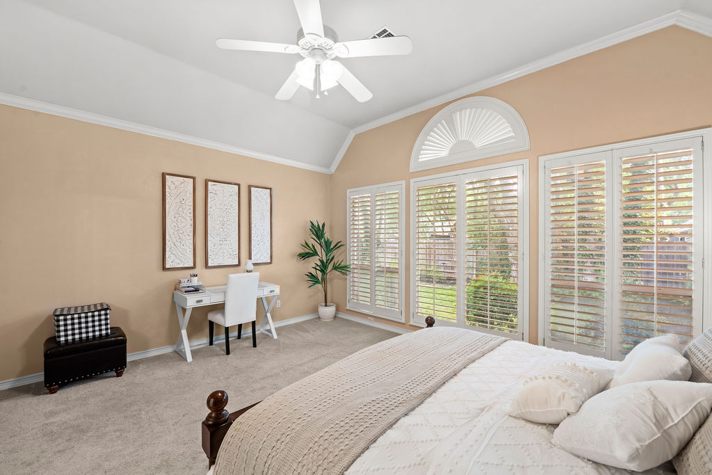 4600 Slickrock Cove Austin, TX 78747 - Photo 20 of 40 a spacious bedroom with a bed and a window