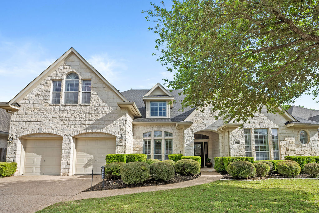4600 Slickrock Cove Austin, TX 78747 - Photo 2 of 40 a front view of a house with a garden