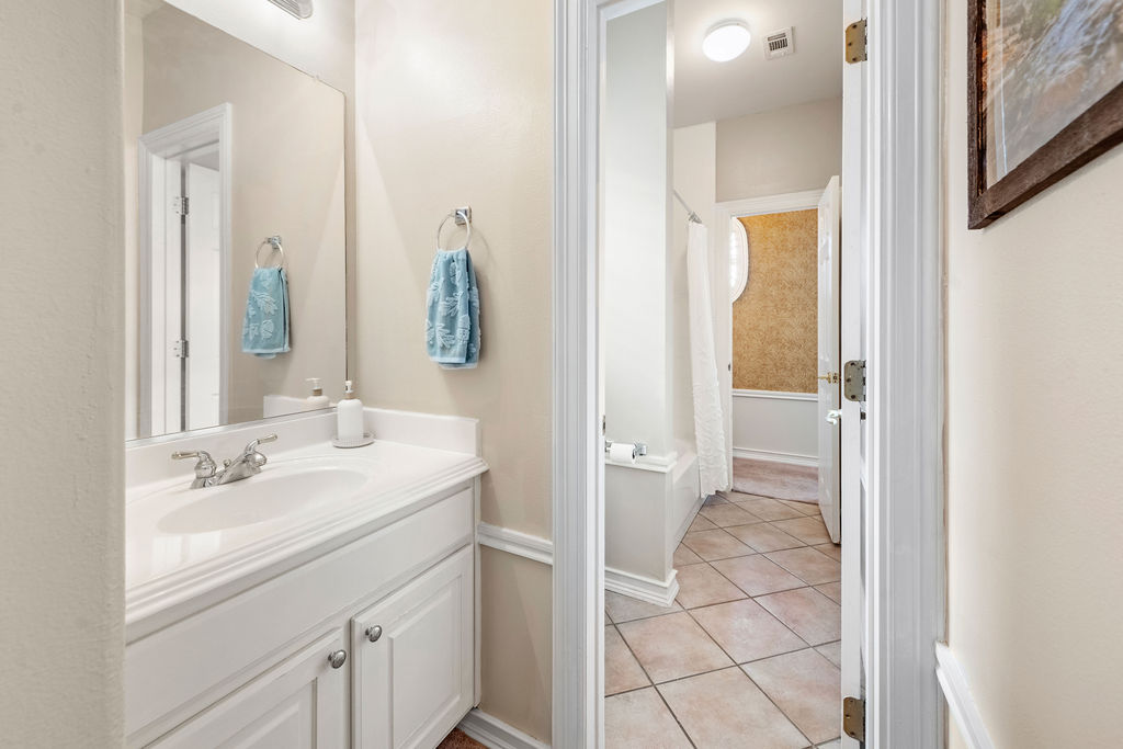 4600 Slickrock Cove Austin, TX 78747 - Photo 27 of 40 a bathroom with a sink and a mirror