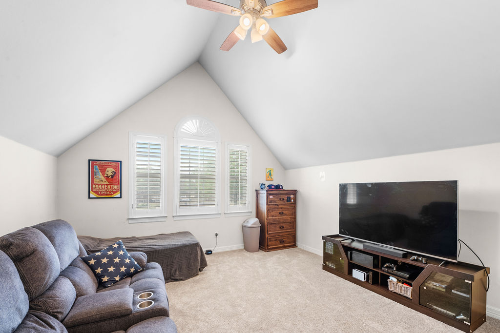 4600 Slickrock Cove Austin, TX 78747 - Photo 34 of 40 a living room with furniture and a flat screen tv